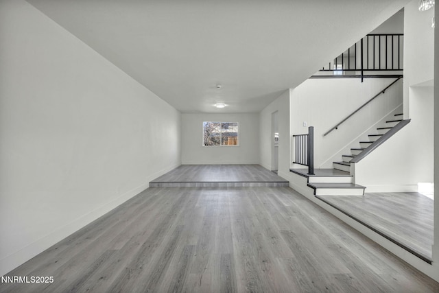 4565 Rio Encantado Ln, Reno, NV 89502 - unfurnished living room with wood finished floors and stairs