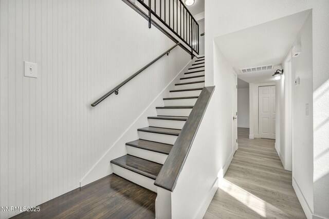 4565 Rio Encantado Ln, Reno, NV 89502 - stairway featuring wood finished floors and baseboards