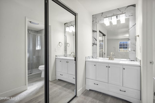 4565 Rio Encantado Ln, Reno, NV 89502 - full bath with two vanities, wood finished floors, and a shower stall