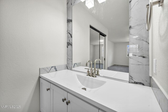 4565 Rio Encantado Ln, Reno, NV 89502 - bathroom with vanity and a textured wall