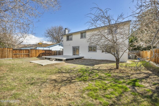 4565 Rio Encantado Ln, Reno, NV 89502 - rear view of house featuring a fenced backyard, a deck, and a chimney
