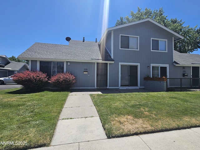 1591 York Way, Sparks, NV 89431 - view of front of home with a front lawn and a shingled roof