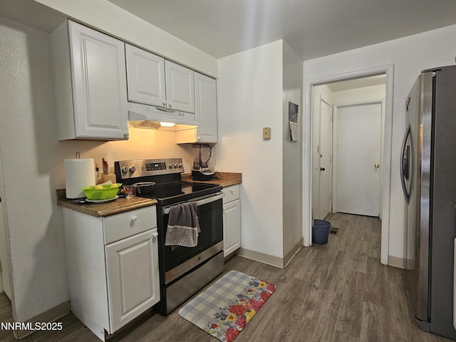 1591 York Way, Sparks, NV 89431 - kitchen featuring under cabinet range hood, appliances with stainless steel finishes, dark wood finished floors, and white cabinets