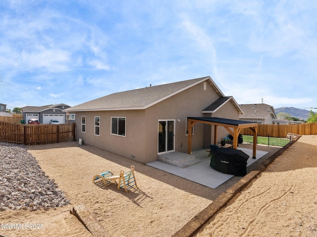 1332 Serenity Cir, Fernley, NV 89408 - back of property featuring a patio, a fenced backyard, and stucco siding