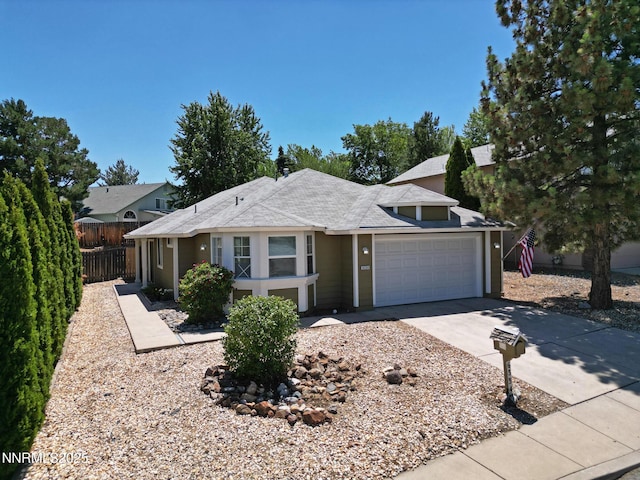 6334 Park Pl, Reno, NV 89523 - view of front of property featuring an attached garage, concrete driveway, and a shingled roof