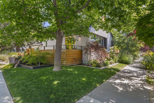 1296 Nixon Ave, Reno, NV 89509 - view of side of property featuring stucco siding and a lawn