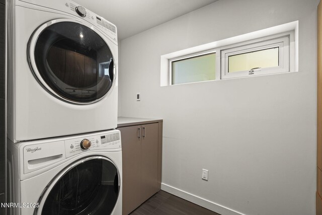 1296 Nixon Ave, Reno, NV 89509 - laundry area with stacked washer / dryer, cabinet space, and dark wood finished floors