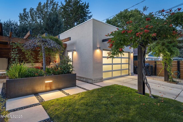1296 Nixon Ave, Reno, NV 89509 - contemporary house with stucco siding, a garage, and driveway
