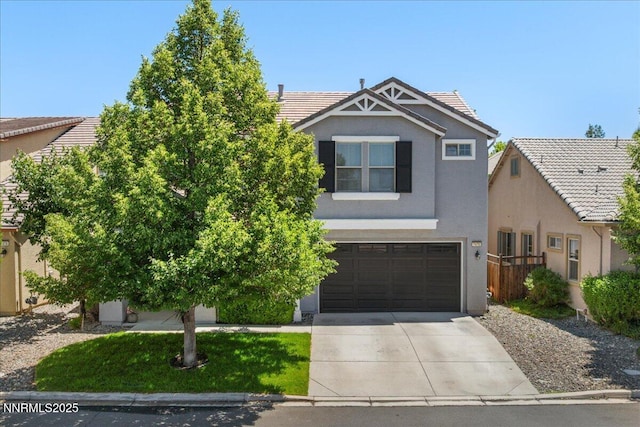 7470 Windswept Loop, Sparks, NV 89436 - view of front of house featuring driveway, stucco siding, a garage, and a tiled roof