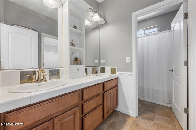 7470 Windswept Loop, Sparks, NV 89436 - full bathroom with double vanity, wainscoting, curtained shower, and stone finish floors