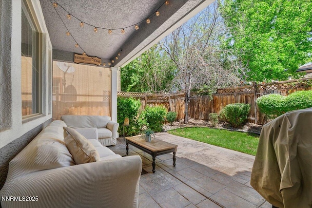 7470 Windswept Loop, Sparks, NV 89436 - fenced backyard with area for grilling, an outdoor living space, and a patio