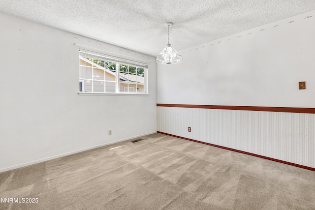 2960 Santa Ana Dr, Reno, NV 89502 - unfurnished room featuring carpet floors, a textured ceiling, and a chandelier