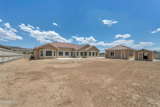 11575 Anthem Dr, Spanish Springs, NV 89441 - rear view of property with a storage shed