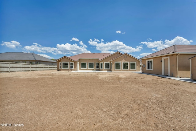 11575 Anthem Dr, Spanish Springs, NV 89441 - back of property featuring stucco siding and a tile roof