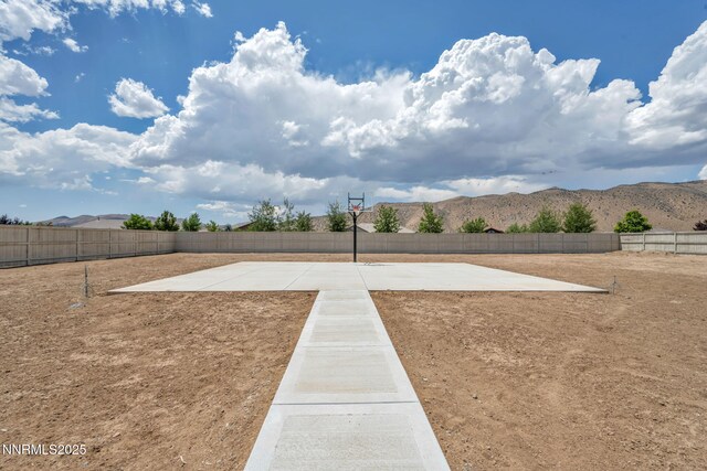 11575 Anthem Dr, Spanish Springs, NV 89441 - view of yard featuring basketball court and a mountain view
