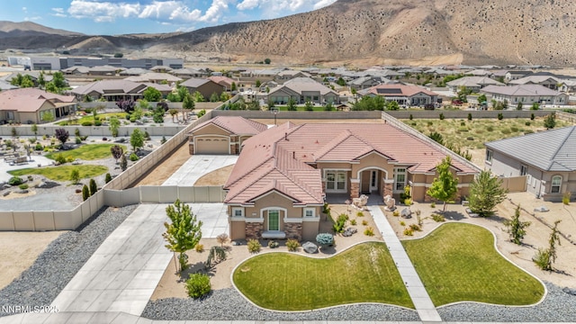 11575 Anthem Dr, Spanish Springs, NV 89441 - view of front of house with a tiled roof, stucco siding, stone siding, and a mountain view