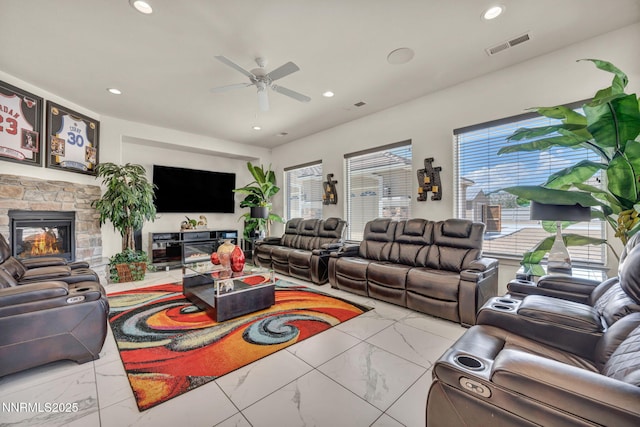 11575 Anthem Dr, Spanish Springs, NV 89441 - living area featuring marble finish flooring, a ceiling fan, a stone fireplace, and recessed lighting