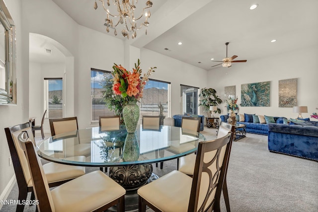 11575 Anthem Dr, Spanish Springs, NV 89441 - dining space with carpet floors, arched walkways, recessed lighting, a ceiling fan, and a high ceiling