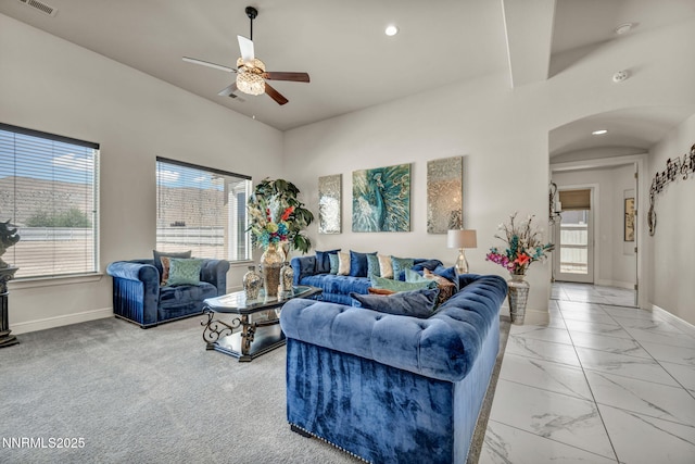 11575 Anthem Dr, Spanish Springs, NV 89441 - living area with arched walkways, ceiling fan, light marble finish floors, and recessed lighting
