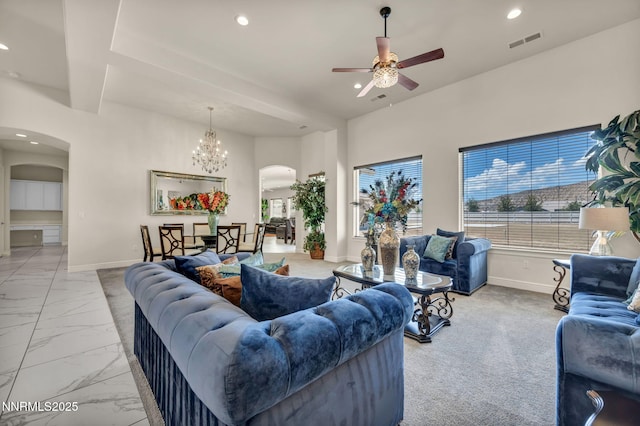 11575 Anthem Dr, Spanish Springs, NV 89441 - living area with arched walkways, ceiling fan, light marble finish floors, recessed lighting, and a chandelier