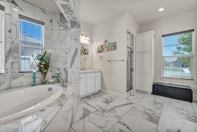 11575 Anthem Dr, Spanish Springs, NV 89441 - bathroom with vanity, plenty of natural light, marble finish floors, a bath, and recessed lighting