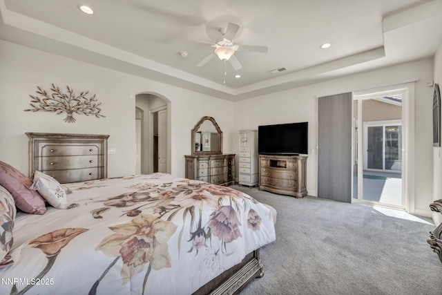 11575 Anthem Dr, Spanish Springs, NV 89441 - bedroom featuring a raised ceiling, carpet flooring, arched walkways, recessed lighting, and ceiling fan
