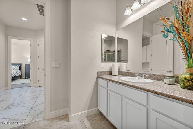 11575 Anthem Dr, Spanish Springs, NV 89441 - bathroom featuring vanity, marble finish floors, and connected bathroom