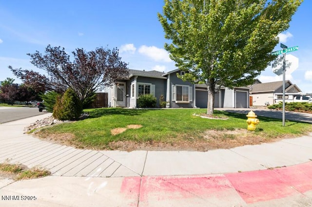 900 Ponderosa Ct, Dayton, NV 89403 - view of property hidden behind natural elements featuring a front yard, driveway, and an attached garage