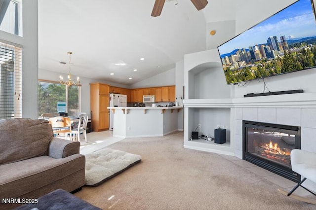 900 Ponderosa Ct, Dayton, NV 89403 - living room featuring light carpet, a ceiling fan, a chandelier, a fireplace, and recessed lighting