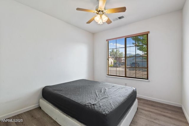 900 Ponderosa Ct, Dayton, NV 89403 - bedroom with wood finished floors and ceiling fan