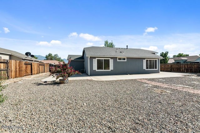 900 Ponderosa Ct, Dayton, NV 89403 - back of house with a patio area and a fenced backyard