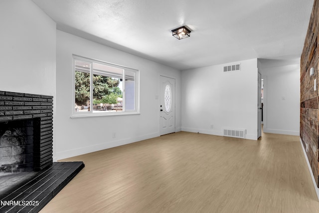 1125 Vance Way, Sparks, NV 89431 - unfurnished living room featuring a fireplace with raised hearth and wood finished floors