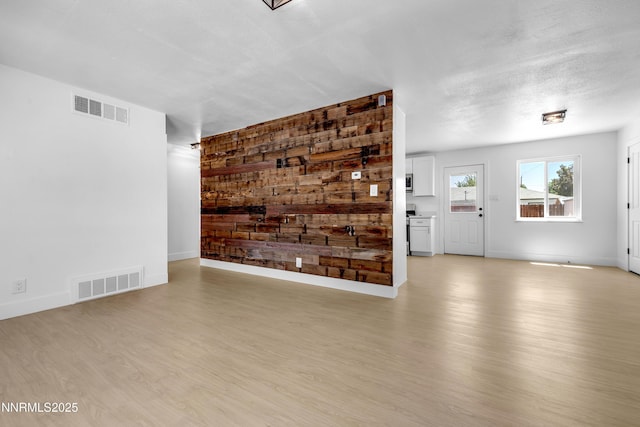 1125 Vance Way, Sparks, NV 89431 - unfurnished living room with light wood-style flooring and baseboards