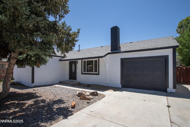 1125 Vance Way, Sparks, NV 89431 - ranch-style house featuring concrete driveway, a chimney, roof with shingles, and a garage