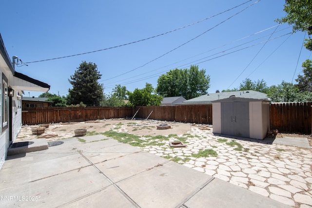 1125 Vance Way, Sparks, NV 89431 - fenced backyard featuring a fire pit, a patio, and a shed