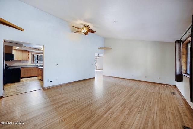 2260 Empire Rd, Reno, NV 89521 - unfurnished living room featuring a ceiling fan, light wood finished floors, and lofted ceiling