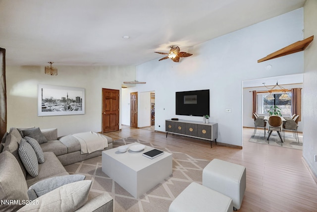 2260 Empire Rd, Reno, NV 89521 - living room featuring ceiling fan, wood finished floors, and high vaulted ceiling