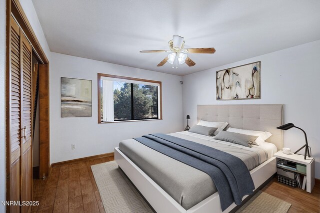 2260 Empire Rd, Reno, NV 89521 - bedroom with wood finished floors, a closet, and a ceiling fan