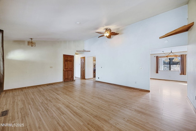 2260 Empire Rd, Reno, NV 89521 - unfurnished living room featuring ceiling fan, high vaulted ceiling, and light wood-type flooring