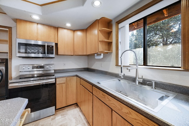 2260 Empire Rd, Reno, NV 89521 - kitchen with stainless steel appliances, recessed lighting, open shelves, and washer / clothes dryer
