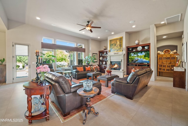 3970 Nature Trl, Reno, NV 89511 - living area featuring ceiling fan, a glass covered fireplace, light tile patterned flooring, and recessed lighting