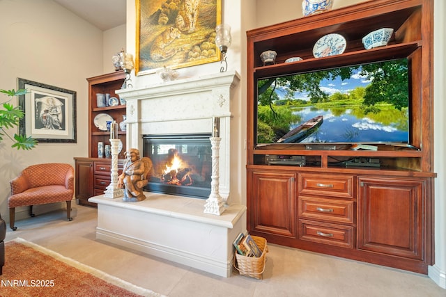 3970 Nature Trl, Reno, NV 89511 - living area with a glass covered fireplace and light tile patterned flooring