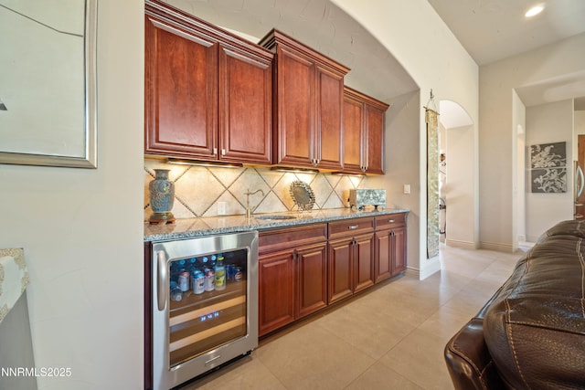 3970 Nature Trl, Reno, NV 89511 - bar area with wine cooler, backsplash, and light tile patterned flooring