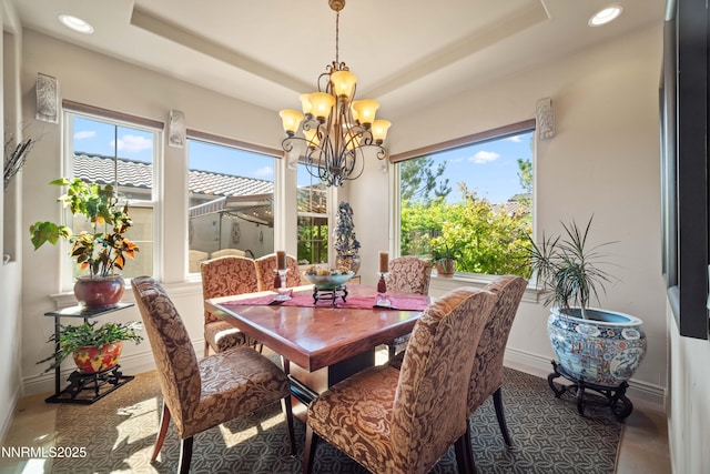 3970 Nature Trl, Reno, NV 89511 - dining area with healthy amount of natural light, a chandelier, recessed lighting, and a tray ceiling