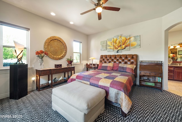3970 Nature Trl, Reno, NV 89511 - carpeted bedroom with arched walkways, recessed lighting, ceiling fan, and ensuite bath