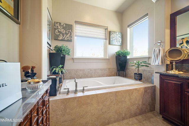 3970 Nature Trl, Reno, NV 89511 - bathroom featuring vanity, a garden tub, and tile patterned flooring