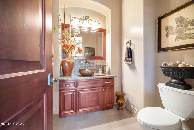 3970 Nature Trl, Reno, NV 89511 - half bath featuring vanity, tile patterned floors, and tasteful backsplash