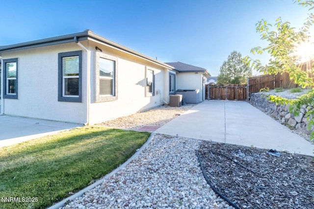 4525 Cobra Dr, Sparks, NV 89436 - view of home's exterior with a patio, stucco siding, and a gate