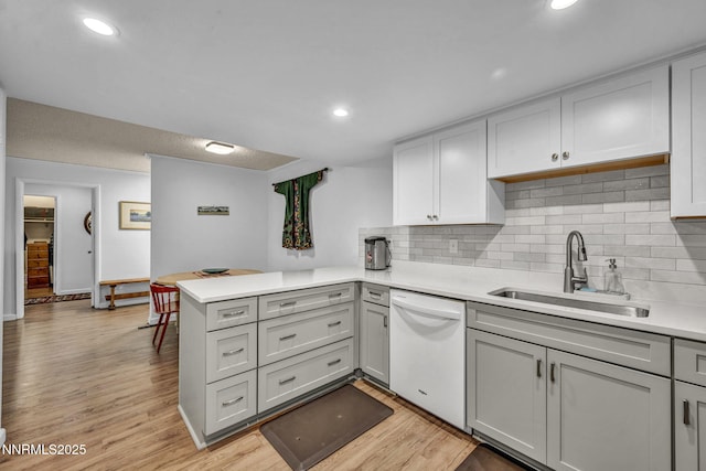 2300 Dickerson Rd Unit 25, Reno, NV 89503 - kitchen featuring dishwasher, a peninsula, light countertops, backsplash, and recessed lighting
