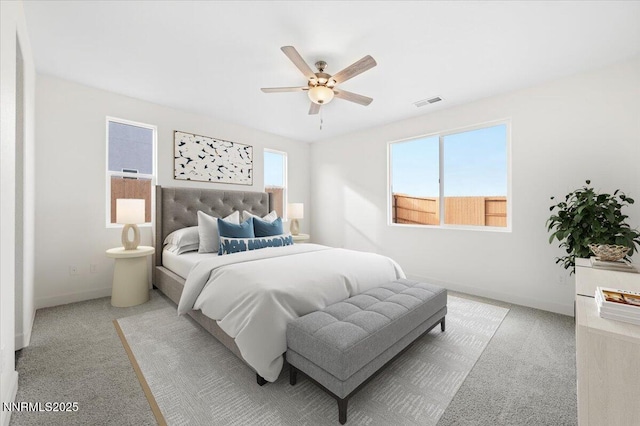 847 Agate Way, Fernley, NV 89408 - bedroom with light colored carpet and a ceiling fan
